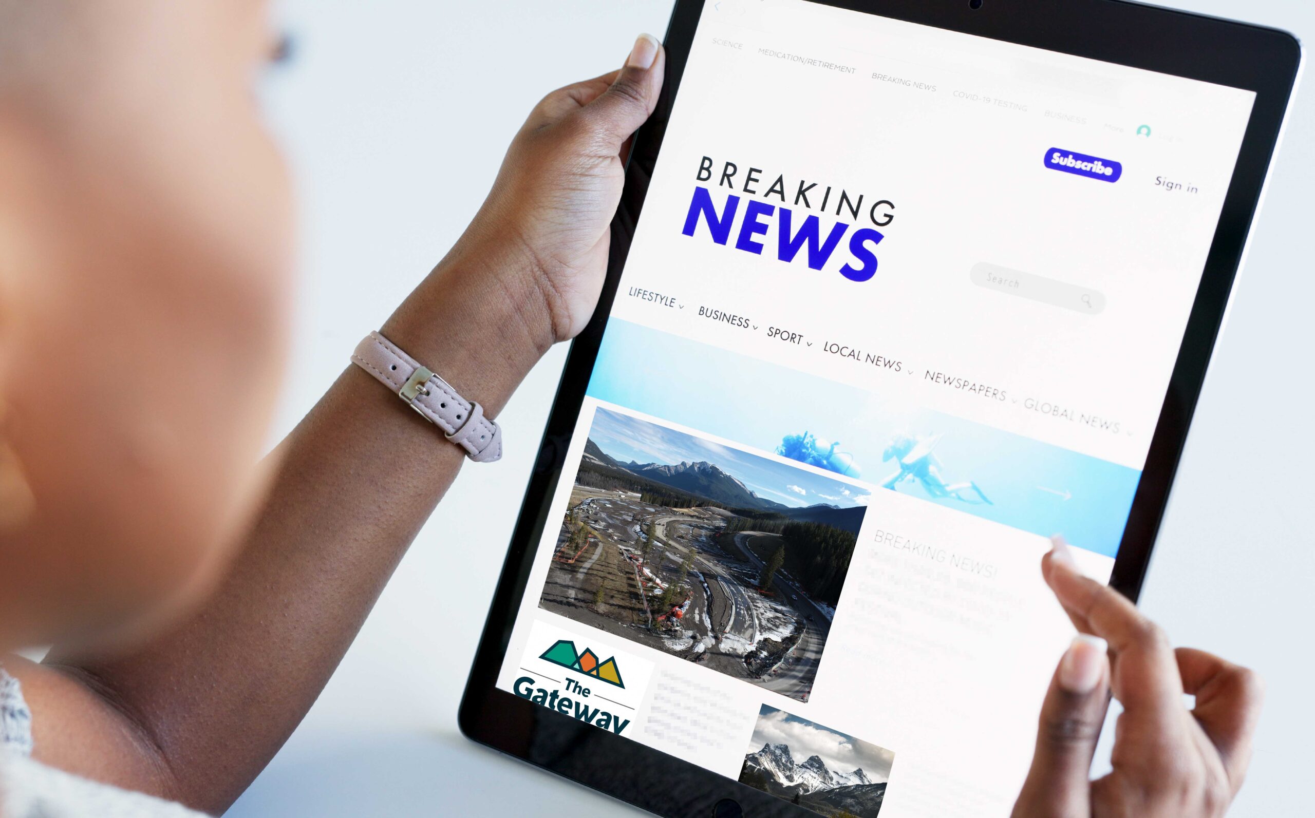 Woman reading breaking news on a tablet