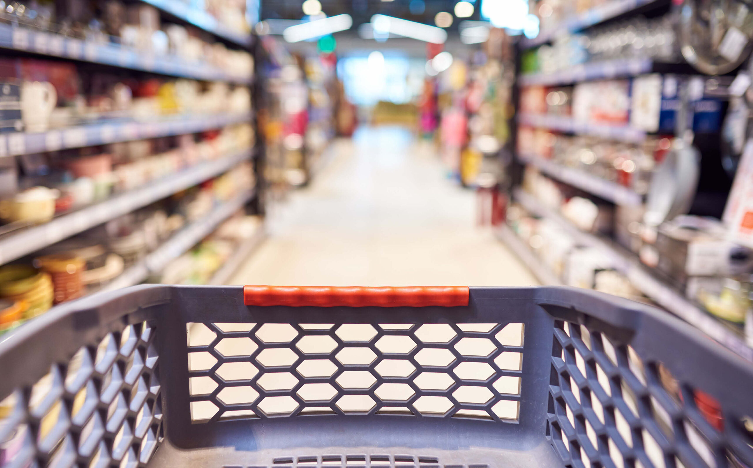 Interior of grocery store with shopping cart